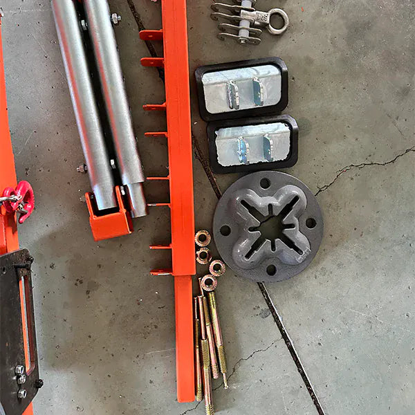 Katool KT-CL150 accessory layout from alternate angle: tubular cross beam, base plate, clamp blocks, threaded rods, side rail