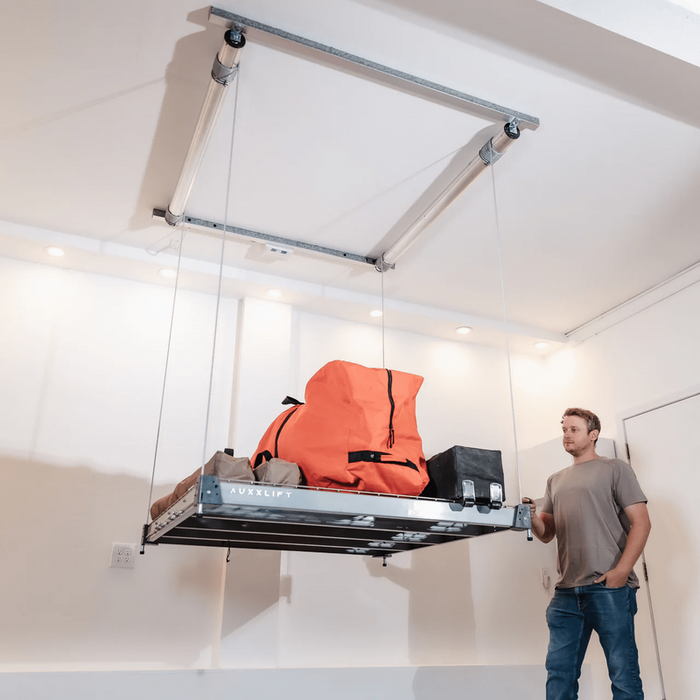 https://cdn.shopify.com/s/files/1/0771/5550/0318/files/Auxx-Lift-Motorized-Storage-Platform-With-User.png?v=1741287411