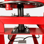 Turntable underside showing threaded spindle and wing-nut mounts