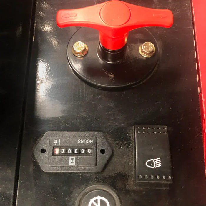 Operator console on the Katool KT-EX20 mini excavator with battery disconnect, hour meter, and headlight switch